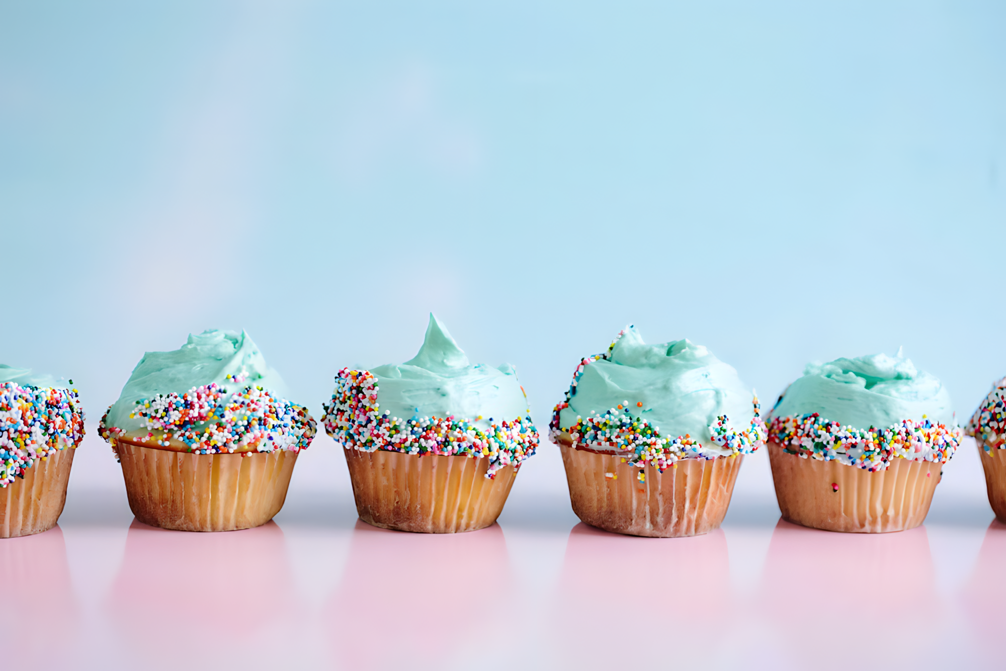 Cupcakes light blue frosting with sprinkles